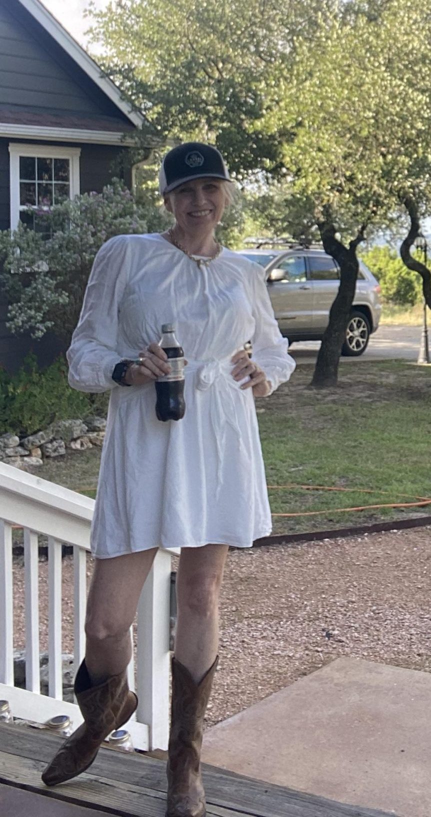 Austin real estate expert Ellen Burns touring a Texas Hill Country home with a smile